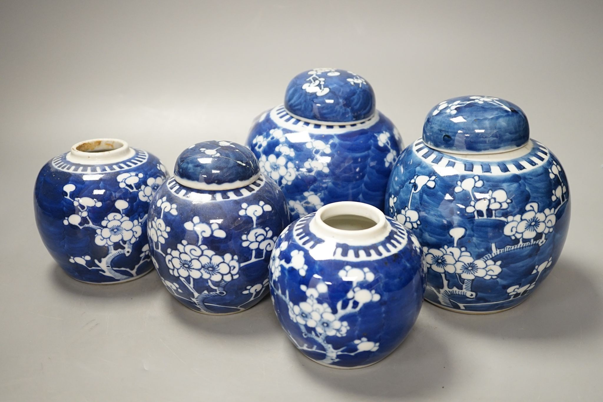 A pair of Chinese blue and white vases and eleven jars, six with covers., Vase and matching cover 28 cms high.